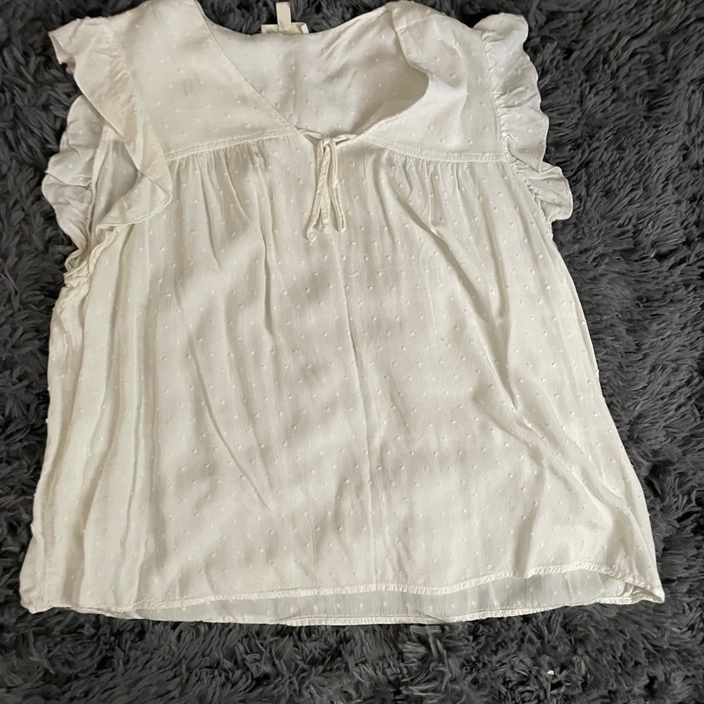 Como Blu ruffled Swiss dot capsleeved shirt